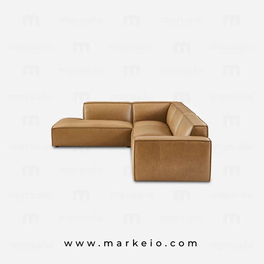 Canapé d'angle de luxe en similicuir marron pour intérieur chic à Marrakech.