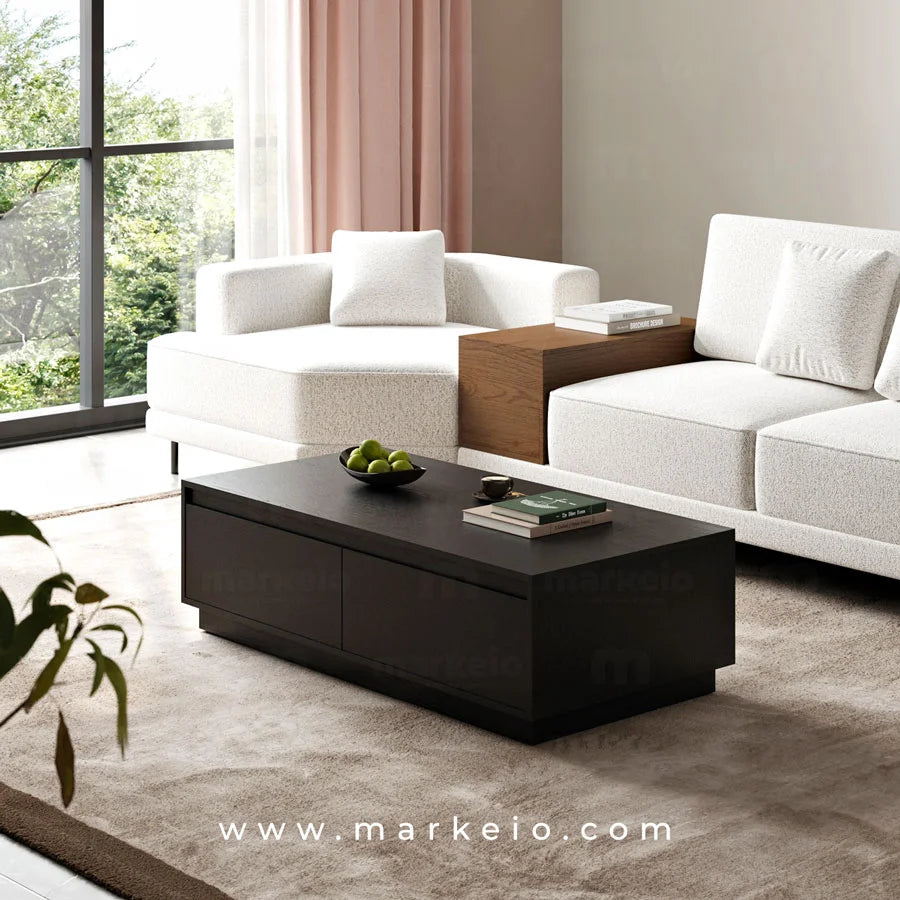 Grande table basse noire avec tiroirs invisibles pour un salon épuré.