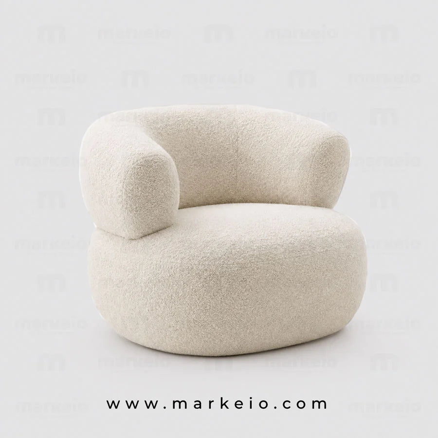 Fauteuil design Ukimo en tissu bouclé blanc crème aux formes rondes et sculpturales