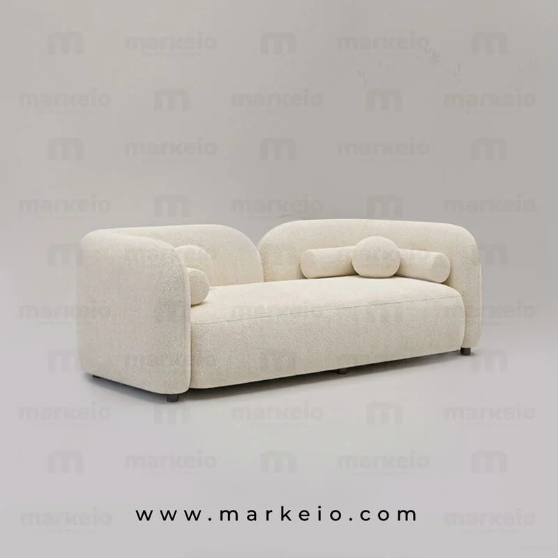 Canapé Almos ivoire au design arrondi avec revêtement effet bouclé, disponible chez Markeio au Maroc.
