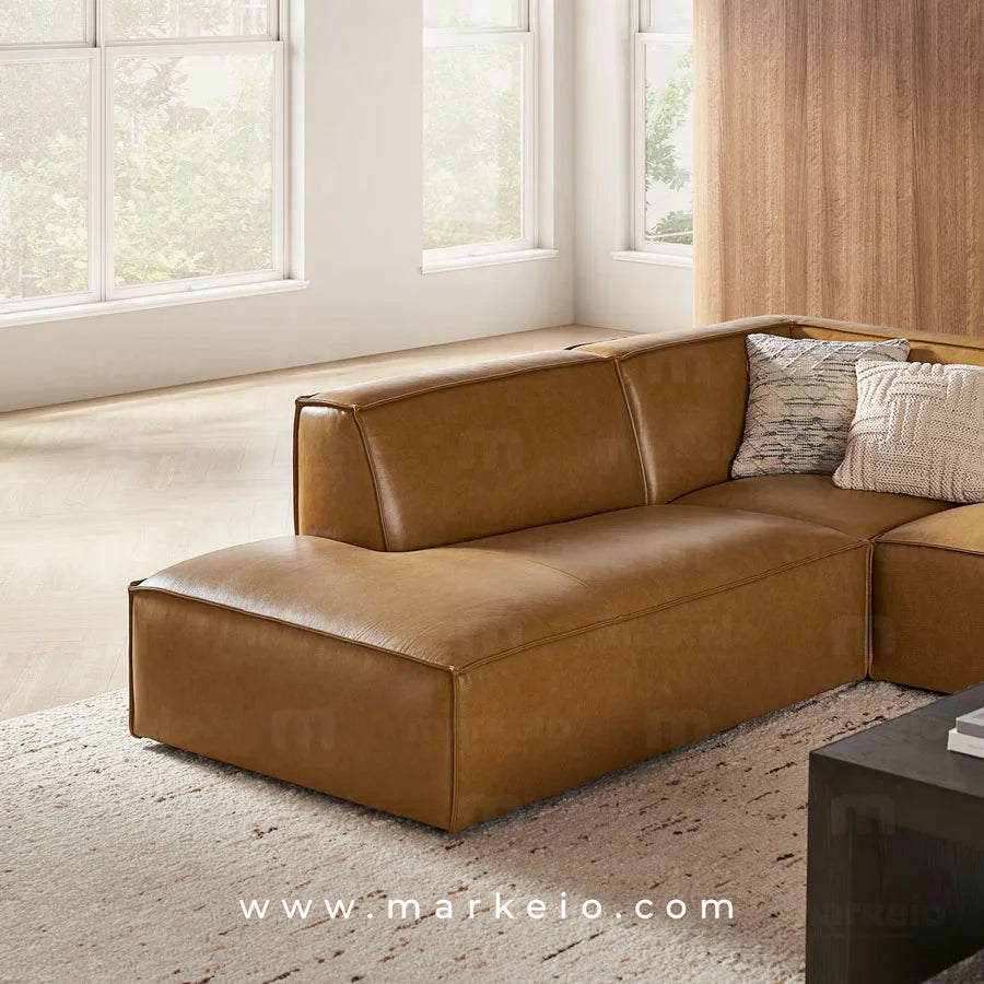 Canapé d'angle avec méridienne à droite modèle Divano en similicuir caramel.