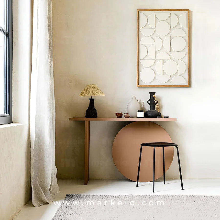 Coiffeuse Orma au design asymétrique avec base circulaire et plateau fin.