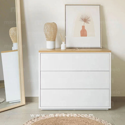 Meuble de rangement à 3 tiroirs avec système d'ouverture par pression.