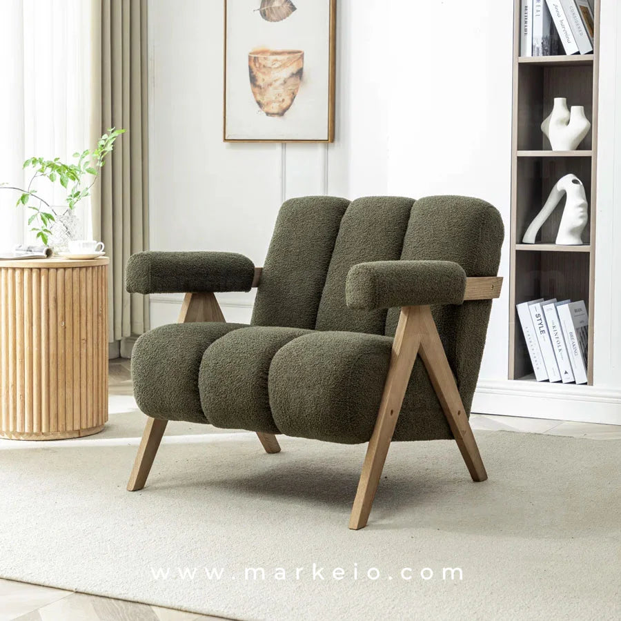 Gros plan sur le tissu bouclé texturé et les rainures verticales de l'assise du fauteuil Armo.