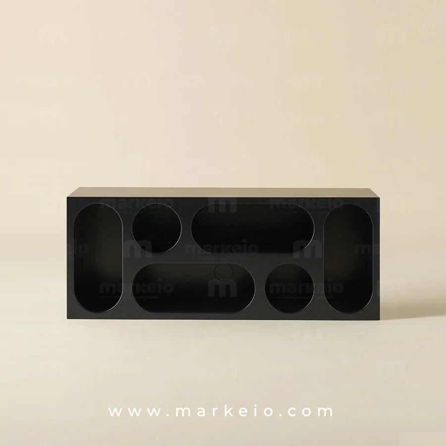 Meuble d'entrée sculptural au design graphique noir mat.