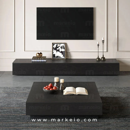 Mobilier TV noir avec rangements invisibles pour un intérieur épuré.